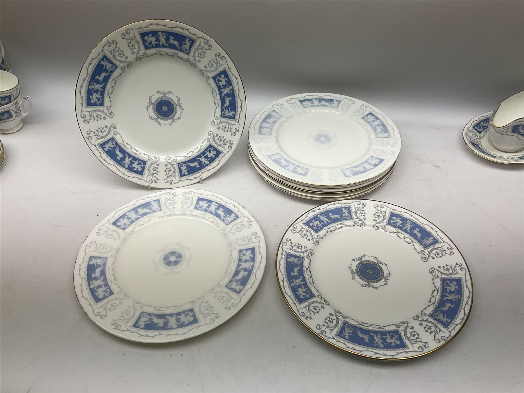 Coalport Revelry pattern tea and dinner wares, comprising nine dinner plates, four salad plates, eleven side plates, sauce boat and stand, ten teacups and ten saucers, and preserve pot and cover, together with a Coalport plate of shaped form decorated with pink roses, and a Royal Crown Derby Royal Antoinette pattern trio