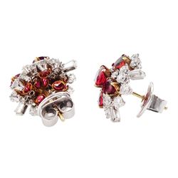 Pair of 18ct white and yellow gold Burmese ruby and diamond stud earrings, each cluster with five oval and round cut rubies and round brilliant cut and tapered baguette cut diamonds, total ruby weight approx 3.40 carat, total diamond weight approx 2.25 carat, in fitted box by Licht & Morrison, London