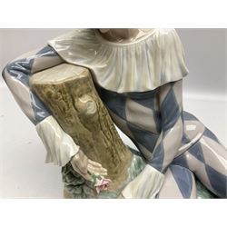 Lladro figure, Harlequin Reclining, modelled as a recumbent harlequin, no 5128, Sculpted by Salvador Furio, year issued 1982, year retired 1987, H28cm 