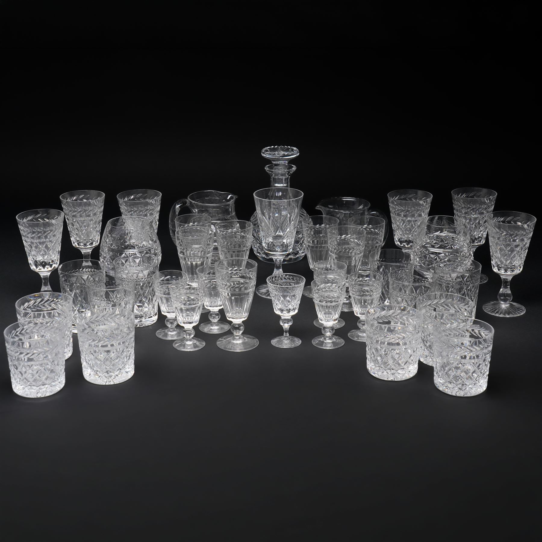 Quantity of Stuart crystal including six Cheltenham whisky tumblers, six claret glasses, six water tumblers and decanter with similar Stuart glass including sherry glasses, two brandy balloons, water jug etc