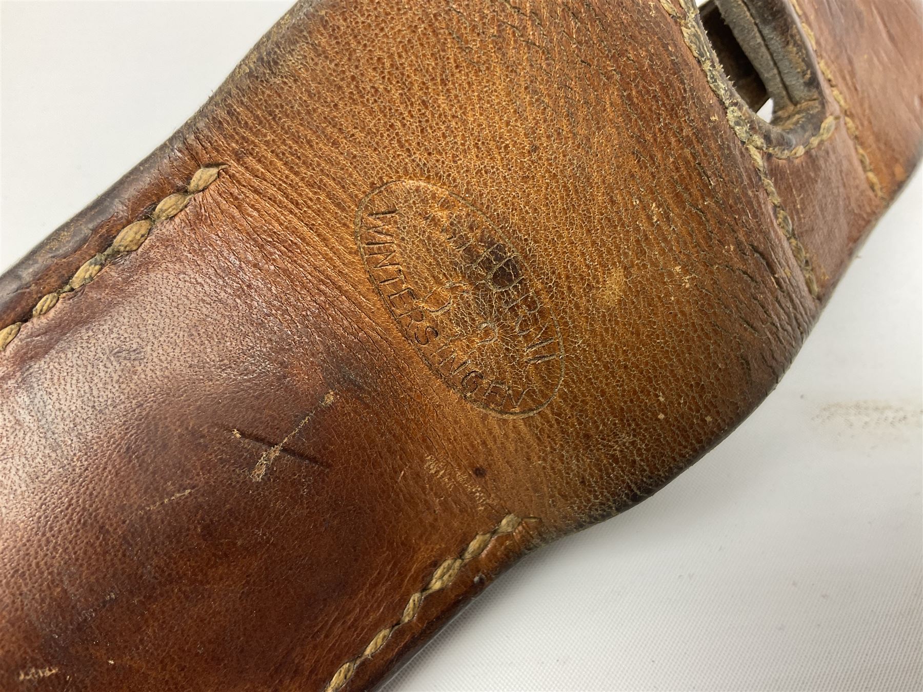 Swiss Schmidt-Rubin M1914 pioneer bayonet, with 48cm steel saw-back blade, the ricasso stamped, ''Waffenfabrik, Neuhausen'', the crosspiece stamped Swiss cross, steel scabbard, leather frog L64cm overall