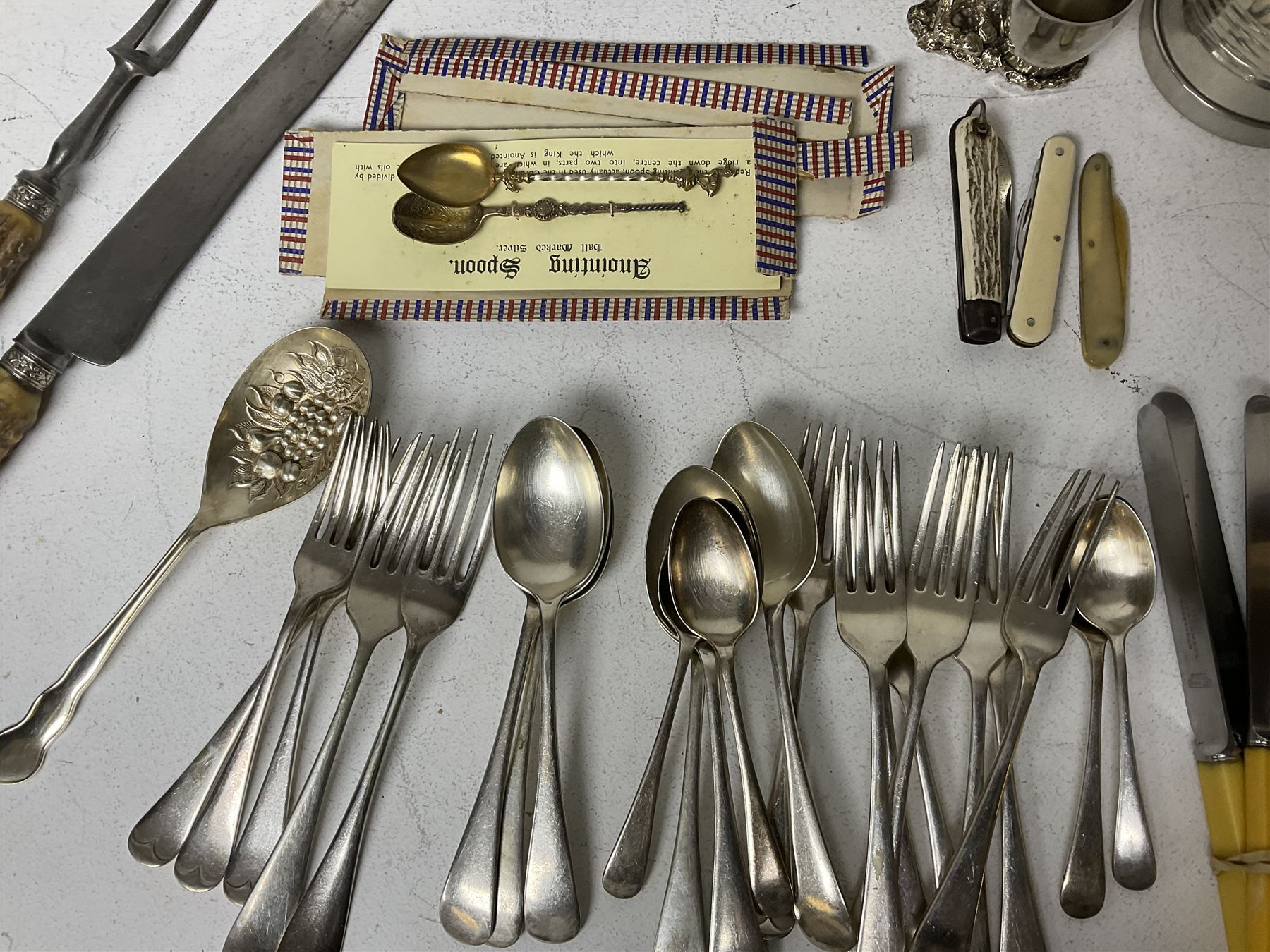 Victorian ebonised wooden desk stand, with brass mounts and two glass inkwells, together with two pewter tankards with Masonic engravings, two pewter quaiches, horn handled carving set, the fork with silver mounts and a collection of other metalware