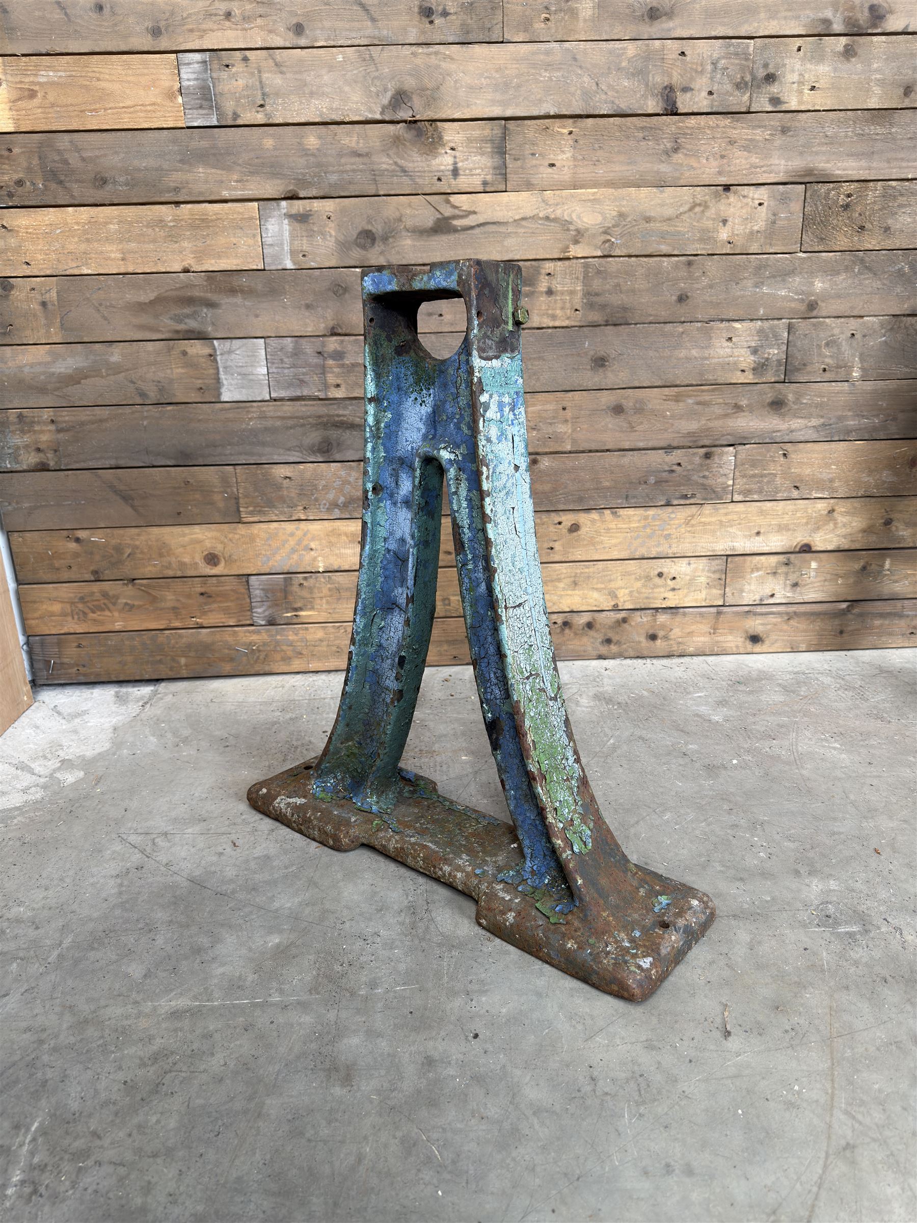 Pair of late 19th century heavy cast iron garden industrial trestles, painted in distressed blue paint