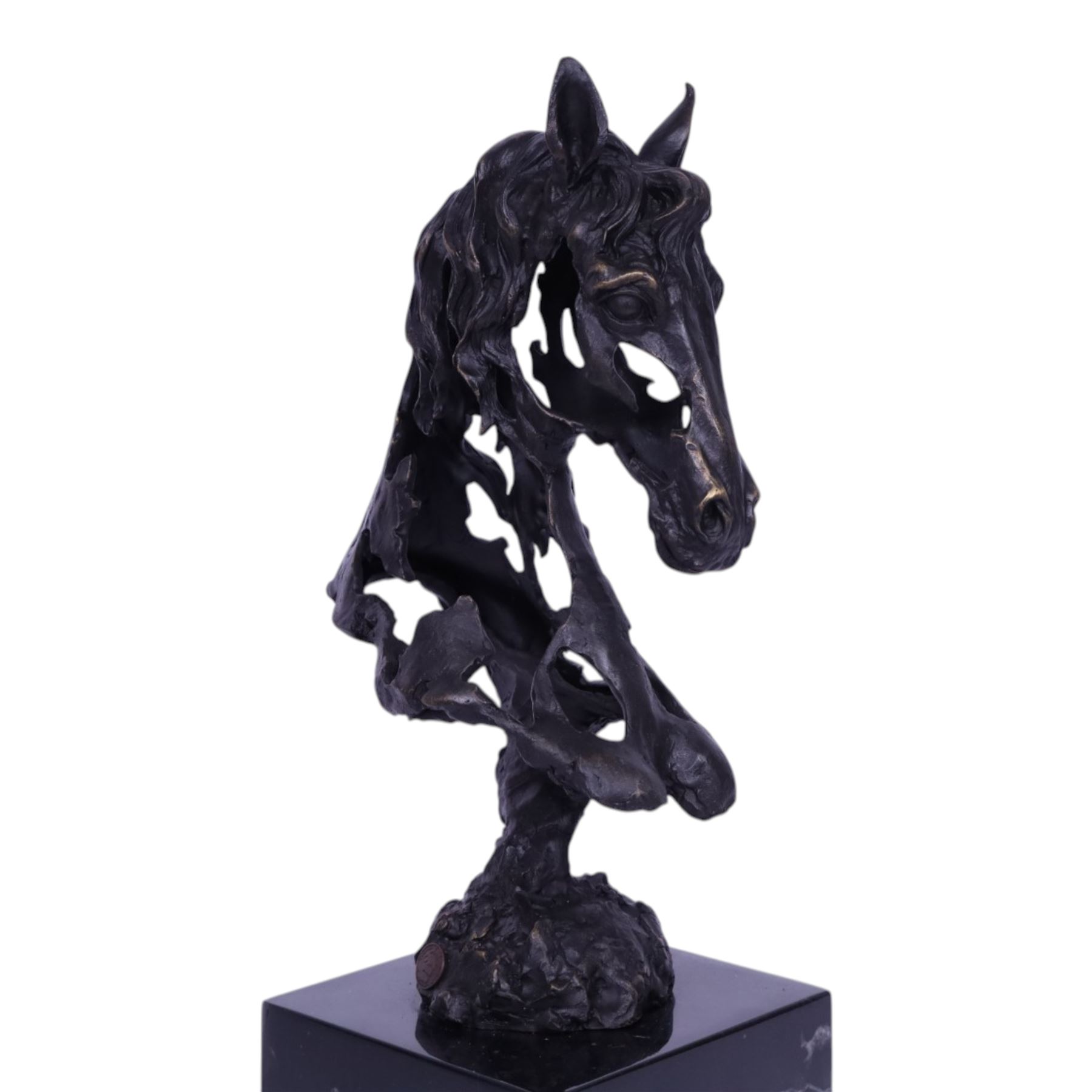 Stylised bronze model of an openwork horses head, signed Gadi and with foundry mark, raised upon black marble plinth, H41cm