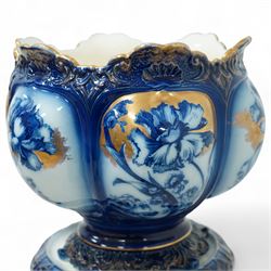 Staffordshire pottery jardiniere, decorated with flowers in blue and heightened in gilt, overall H46cm 