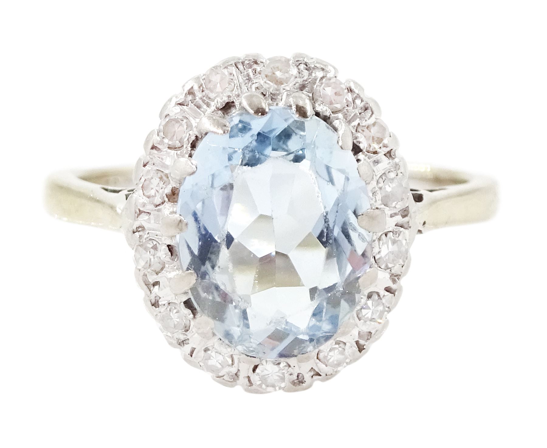 White gold aquamarine and diamond cluster ring, oval cut aquamarine of approx 1.35 carat, with single cut diamond surround, stamped 18ct
