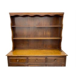 20th century oak dresser and rack, fitted with three drawers and three cupboards
