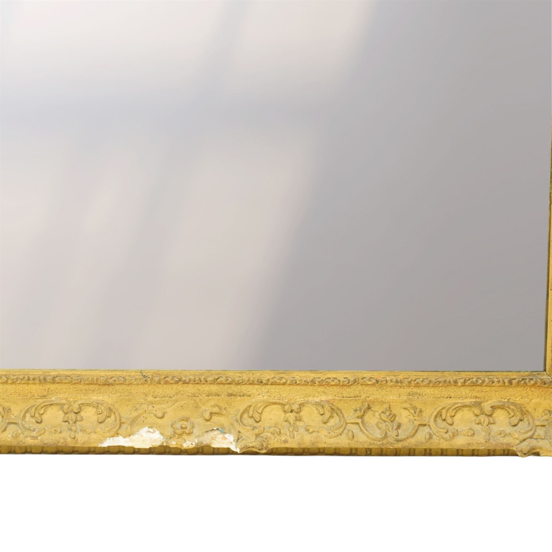 Large Louis XV style gilt framed mirror, the rectangular plate within a pierced and moulded surround decorated with foliate scrolls and flowerheads