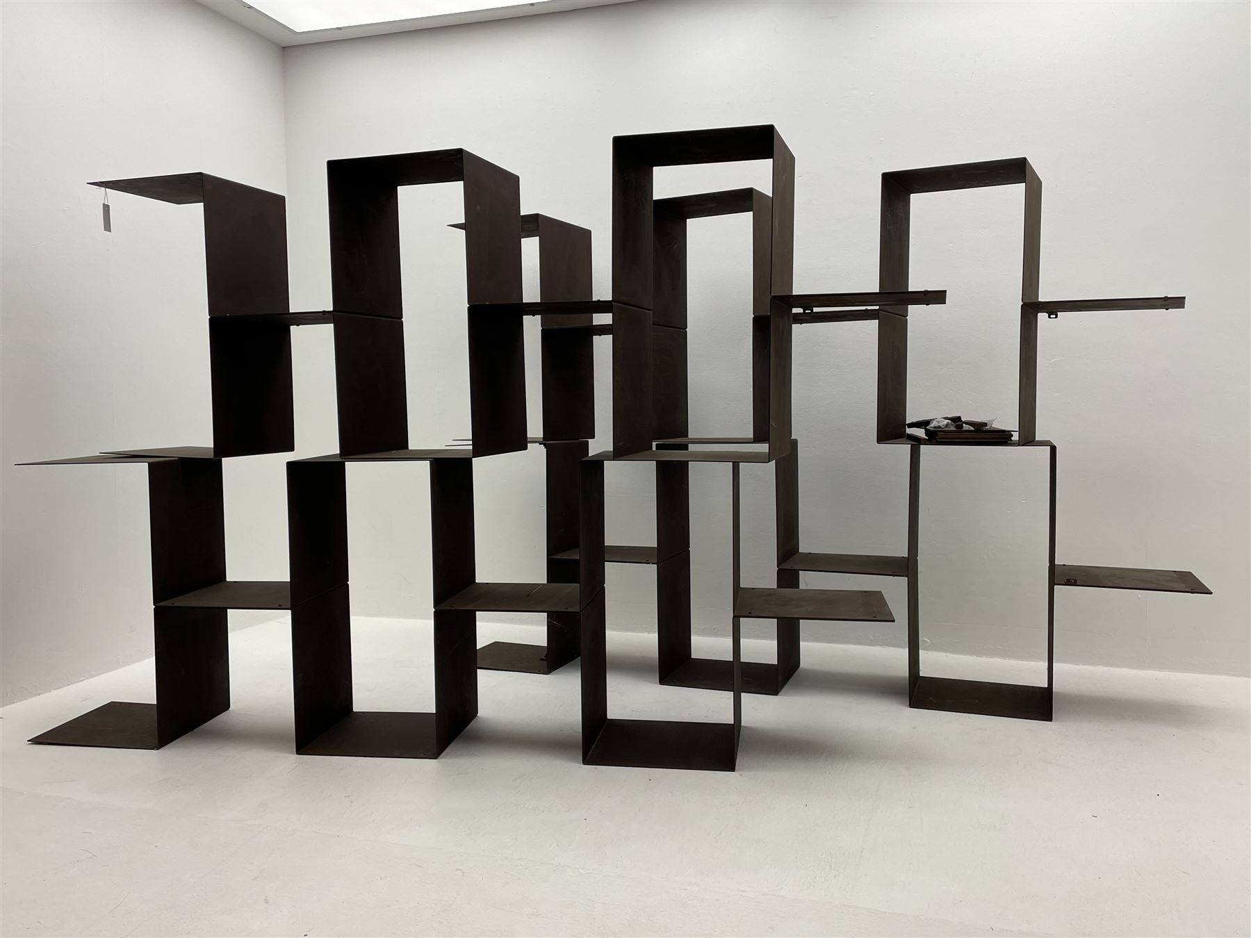 Retailed by The Conran Shop - four sectional modular shelving units, rusted metal finish, each unit - W212cm, H71cm, D33cm