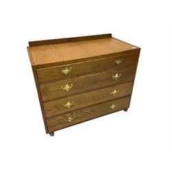 Mid-20th century oak chest, raised back, fitted with four graduating drawers, on castors