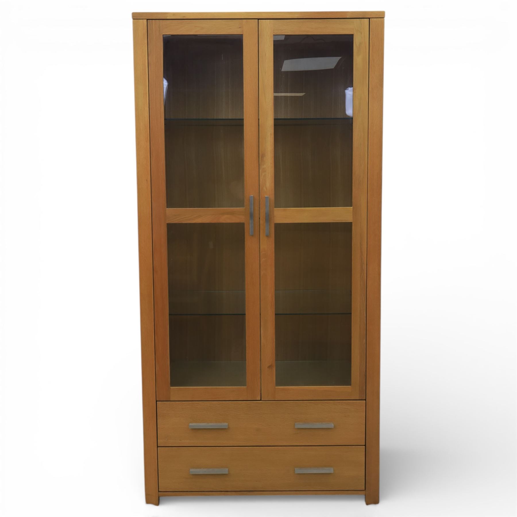 Solid light oak bookcase display cabinet, fitted with two glazed cupboards and two drawers