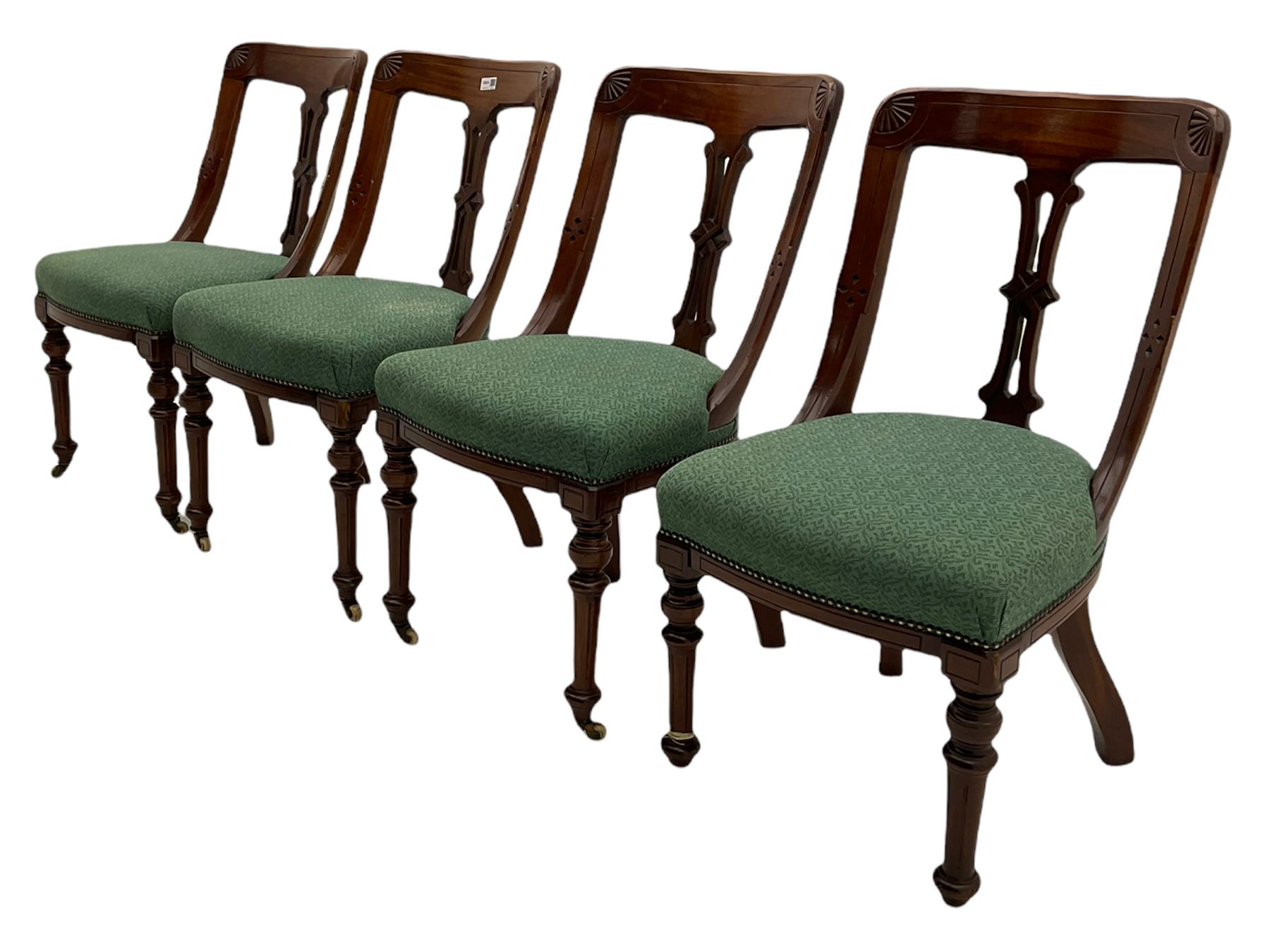 Set of four Victorian mahogany spoon back dining chairs, upholstered seats