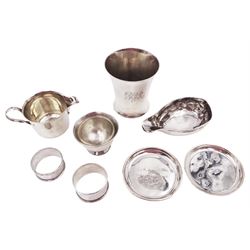 Group of George III and later silver, comprising tipping cup, of oval form with elongated lip and personal engraving to underside, hallmarked London 1791, maker's mark indistinct, Edwardian silver tumbler, of waisted cylindrical form, engraved with monogram to body and personal inscription to base, hallmarked Edward Barnard & Sons Ltd, London 1908, milk jug and sugar bowl, hallmarked Charles Edwards, London 1902, two small 1930s silver pin dishes, each with personal engravings, Page, Keen and Page, Birmingham 1933 and 1939, and two hallmarked napkin rings, tumbler H8.4cm