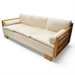 Mid 20th century German Art Deco oak framed divan day bed, rectangular form with slatted side supports, upholstered in cream linen with three removable back cushions, three seat cushions and cylindrical bolster arms, on block feet