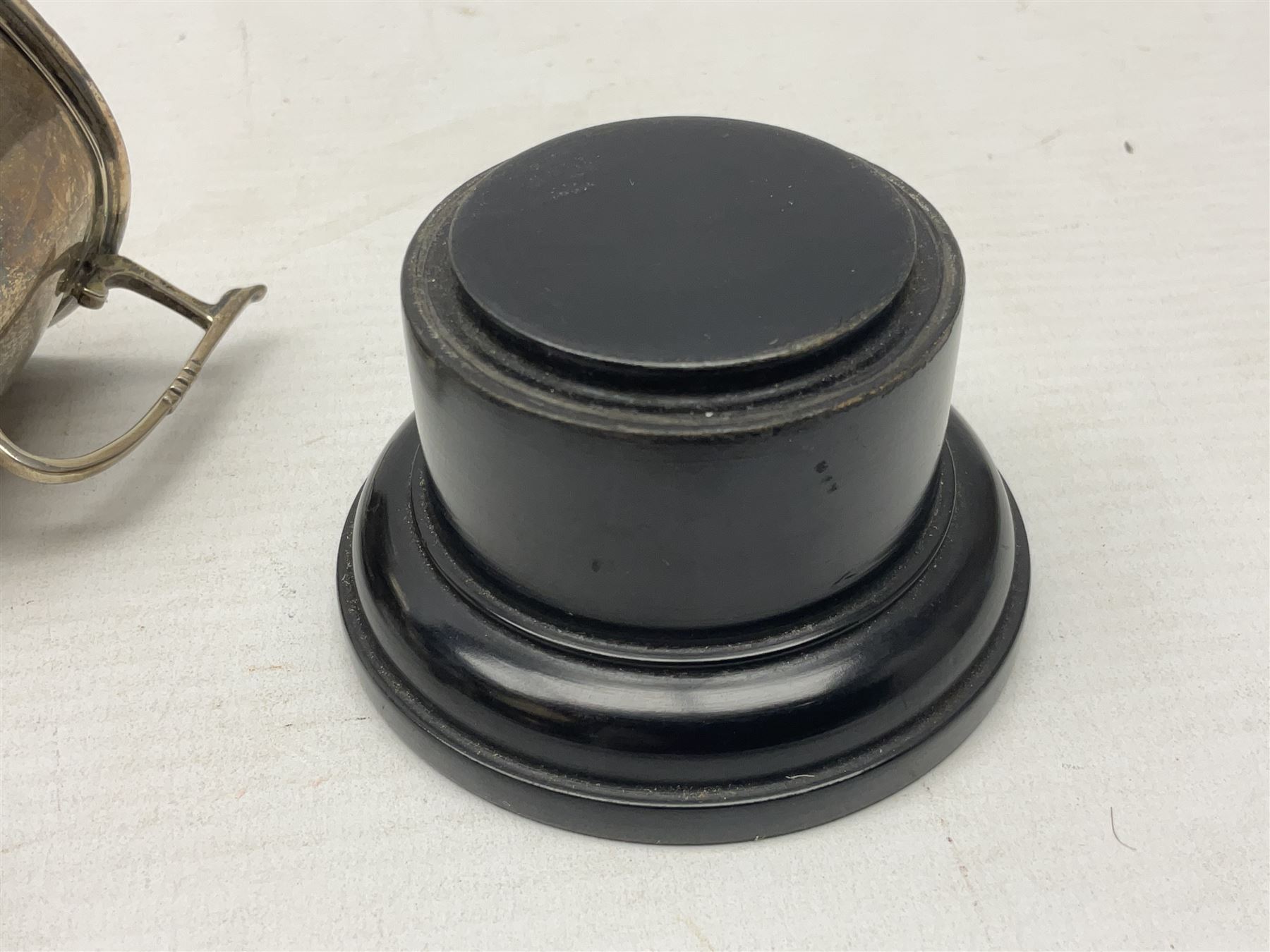 1930's silver twin handled trophy cup, upon black circular plinth, hallmarked Birmingham 1936, approximate silver weight 47 grams