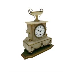 A 19th century French mantle clock in an alabaster case with an 8-day Parisian timepiece movement, case with a flat top surmounted by an urn, on a broad plinth on raised feet, with an enamel dial, Roman numerals and minute markers. With pendulum and giltwood padded base. 


