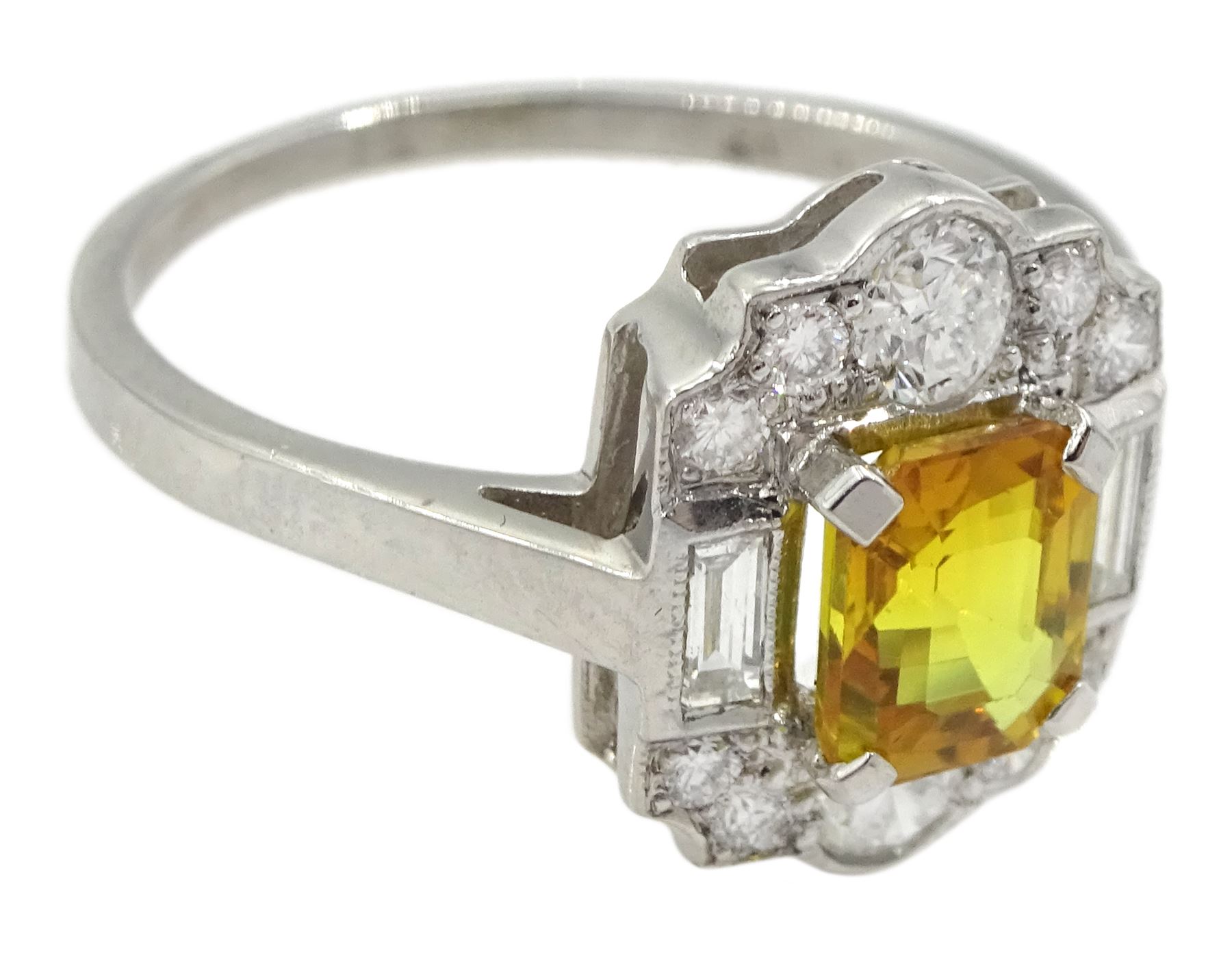 Platinum emerald cut yellow sapphire, baguette and round brilliant cut diamond cluster ring, stamped Plat, sapphire 1.30 carat, total diamond weight 0.55 carat, with World Gemological Institute Report