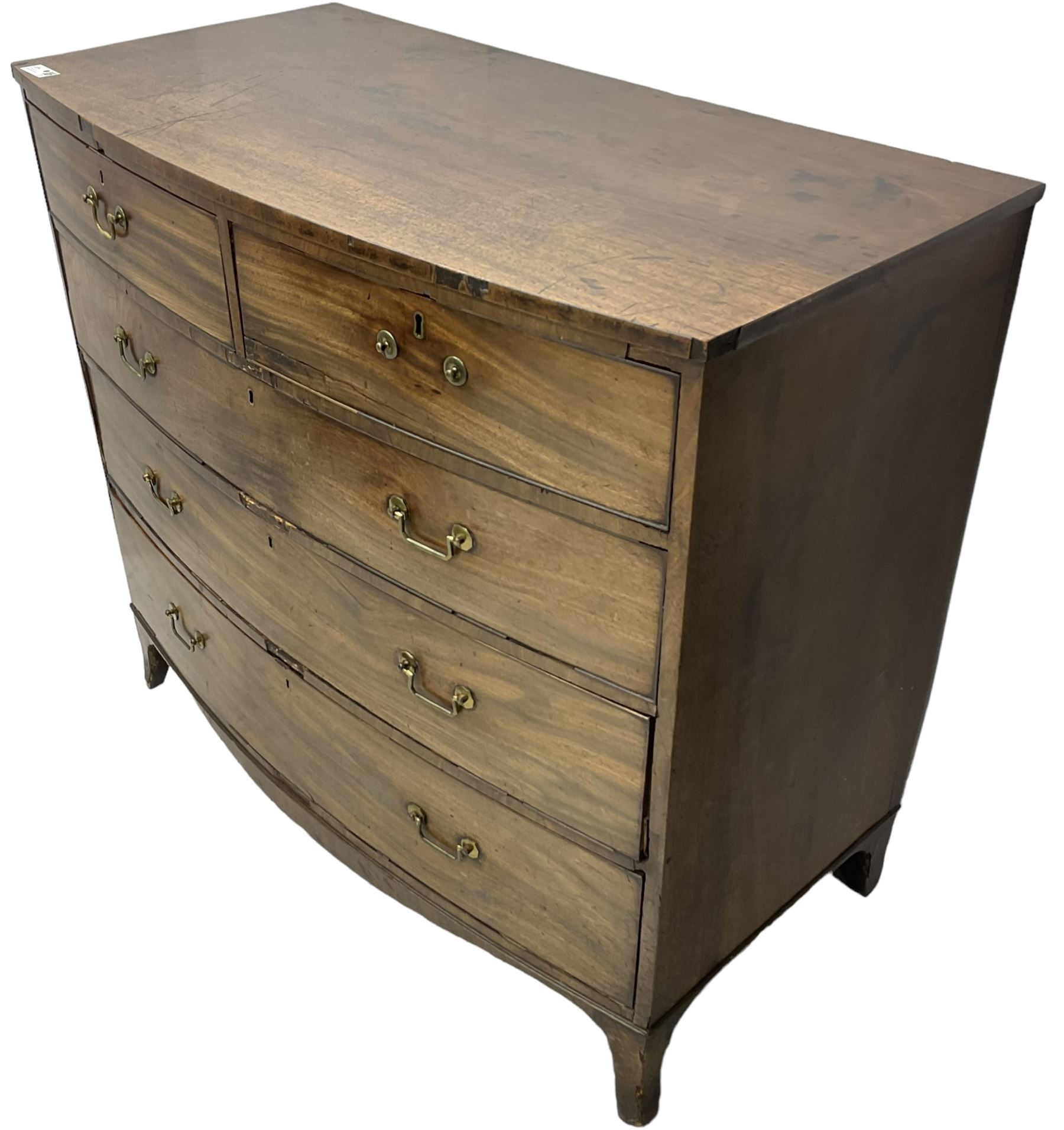 Early 19th century mahogany bow-front chest, fitted with two short over three long cock-beaded drawers, on splayed feet
