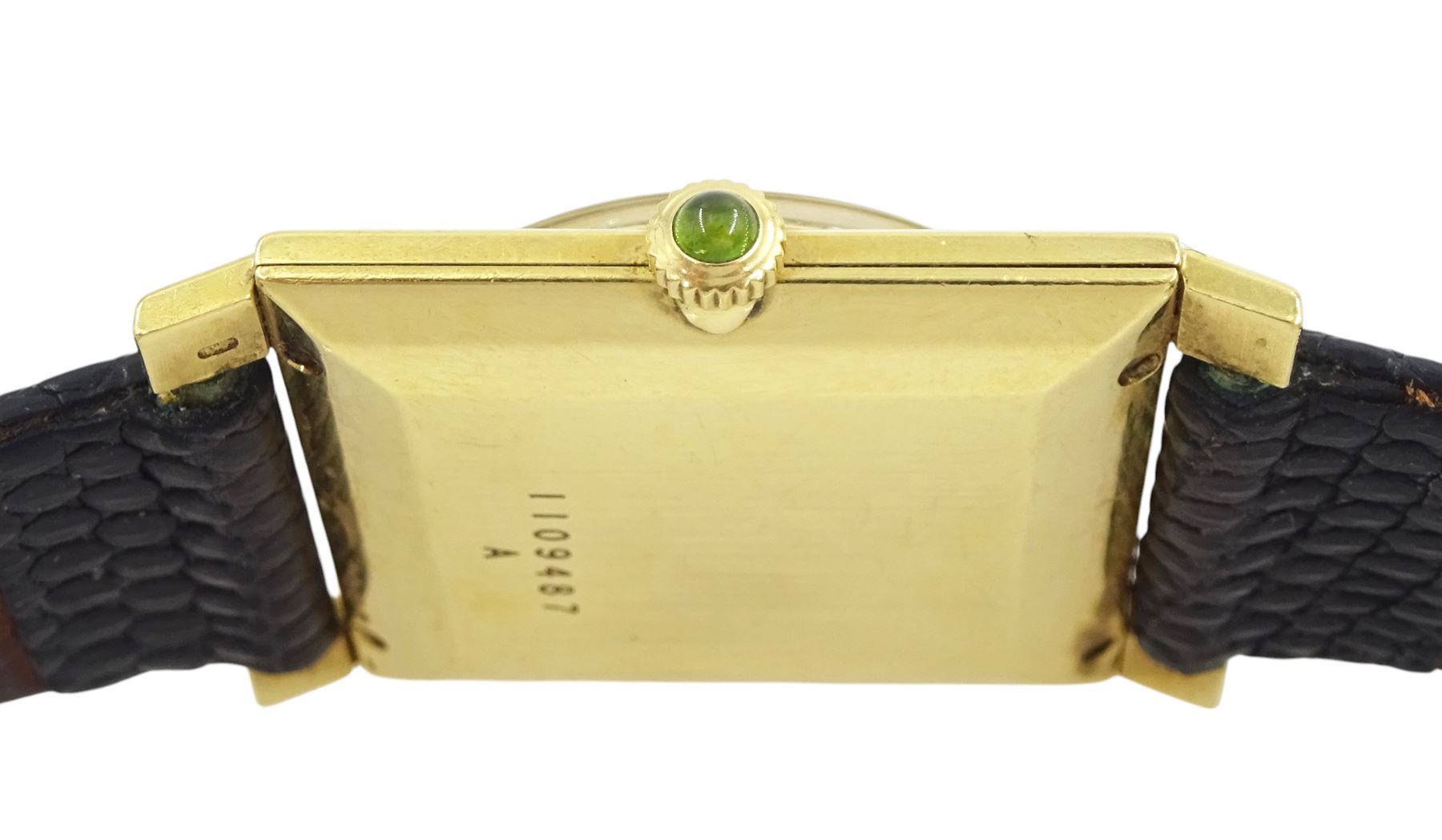 Jaeger LeCoultre gentleman's 18ct gold square cased manual wind wristwatch, champagne dial with yellow sapphire quarter markers, cabochon green sapphire crown, case No. 1109487, on black leather strap