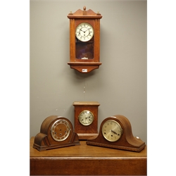  Early 20th century oak dome top clock with Westminster chime, another oak mantel clock with silvered dial, contemporary wall hanging clock in mahogany case and an early 20th century oak clock case  