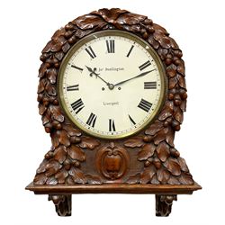 Mid-19th century eight-day Oak cased twin Fusee wall clock with integral support bracket, movement striking the hours on a coiled gong, thirteen-inch painted dial with roman numerals and minute track, blued steel Fleur de Lys hands, dial inscribed “Jos Penlington, Liverpool”, lockable brass bezel with flat glass, rectangular shouldered four pillar movement plates, with rack striking and a recoil anchor escapement, movement pinned to the dial via a steel false plate, rectangular case and bracket on carved corbel supports, profusely carved dial surround with representations of oak leaves and  acorns on a tooled background, two movement doors with sound frets and one pendulum adjustment door.
With Pendulum. 
The Pennington’s were a prolific family of clockmakers working in Liverpool from 1818 until the turn of the 20th century.
