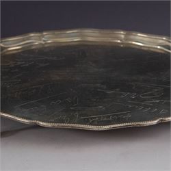 1930s silver salver, of circular form with beaded pie crust rim and upon four claw and ball feet, with presentation engraving to centre reading 'Presented to Second Lieutenant FR Himsworth Royal Signals by the Officers of the 50th Nottingham Motor Divisional Signals on the Occasion of his Marriage 10th September 1939', bordered by the engraved signatures of his colleagues, hallmarked Barker Brothers Silver Ltd, Birmingham 1938, D25cm
