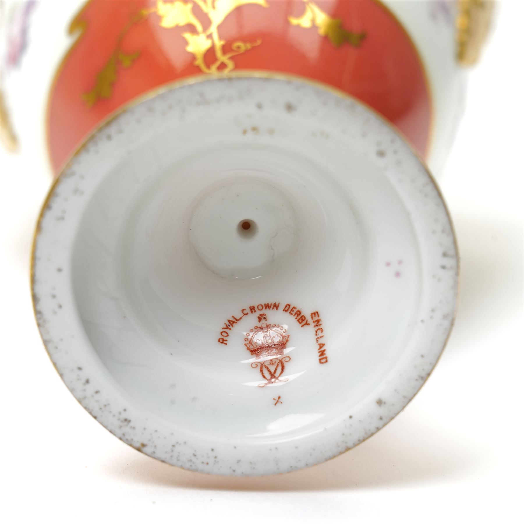 Early 20th century Royal Crown Derby vase and cover, of slender form, the pompadour pink ground with gilt decoration, painted centrally with a tree, printed marks to base, H25cm 