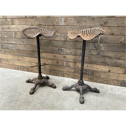 Pair of heavy cast iron tractor seat bar stools