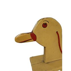 Mid 20th century rocking duck, painted in yellow with red details, H73cm, L79cm