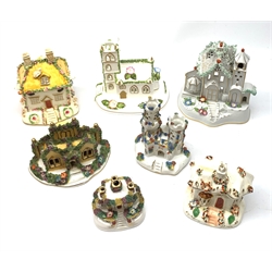 A collection of 19th century and later Staffordshire buildings and pastille burners, together with a Coalport example titled Village Church. 
