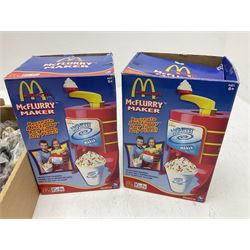 Quantity of Mcdonalds toys and two boxed Mcflurry makers in two boxes