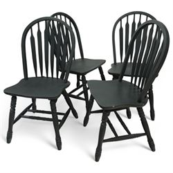 Contemporary country style pine and painted dining table and four chairs, the rectangular plank top with exposed knots and pegged detailing over black painted turned legs, the four Windsor style chairs with shaped seats, spindle splats and turned stretchers, also painted black