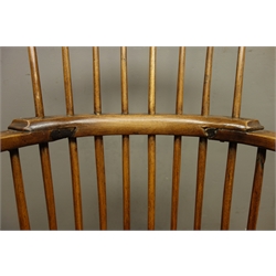  Elm and beech comb back Windsor arm chair, curved arm supports and turned legs  