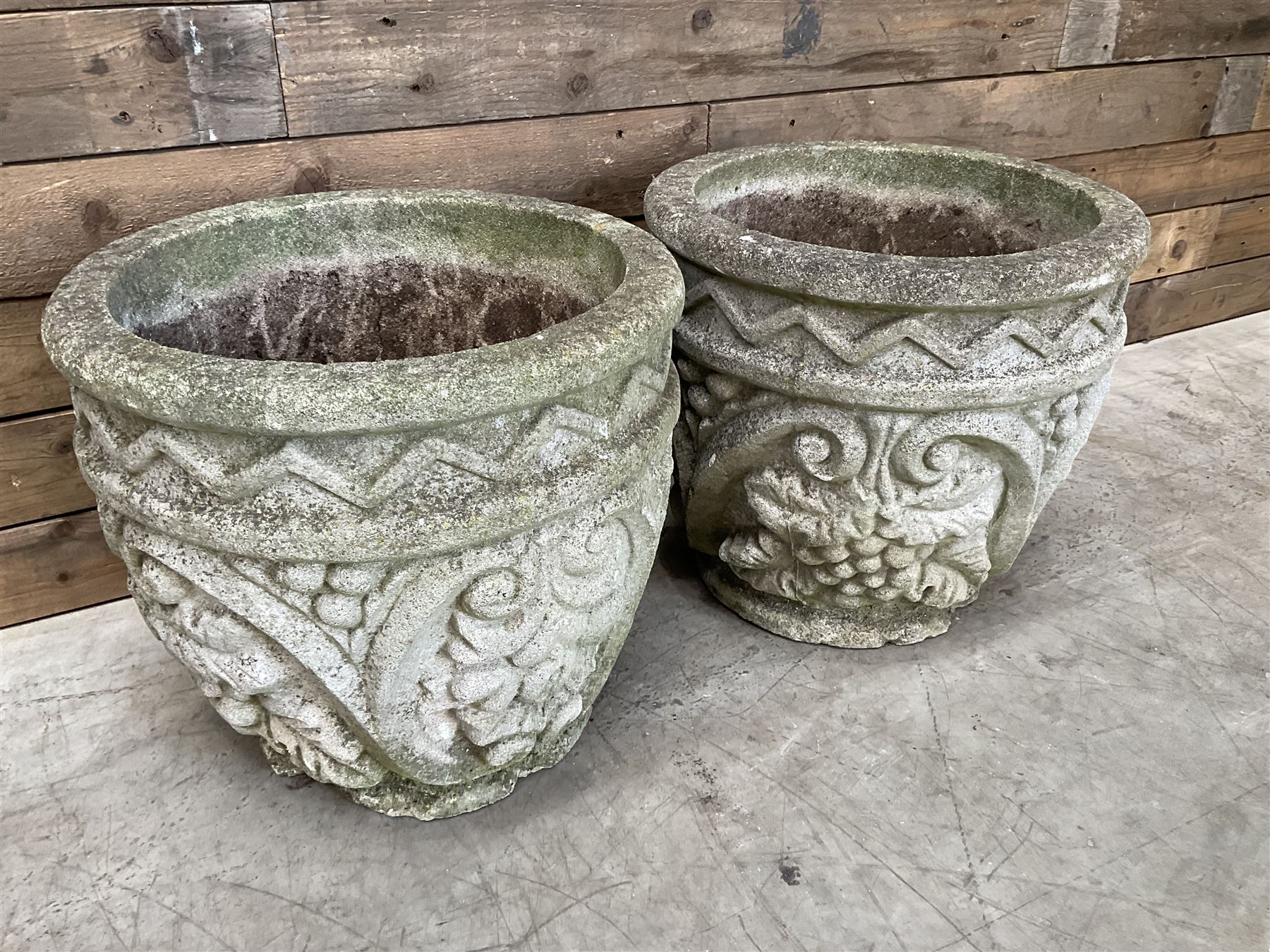 Pair of cast stone ornate circular planters