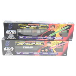 Four Kenner Star Wars electronic weapons, comprising Darth Vader Lightsabre no. 69796, Luke Skywalker Lightsabre no. 69795, The Power Of The Force Heavy Blaster no. 27737, The Power Of The Force Blaster Rifle no. 27738, all boxed