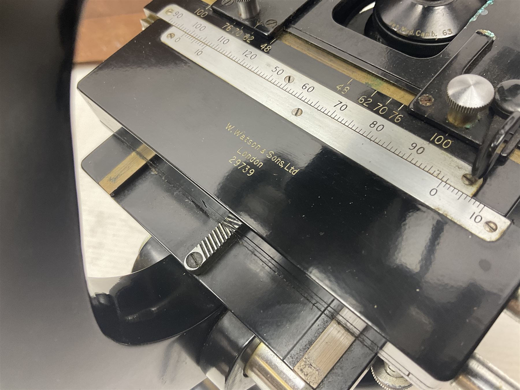 Four microscopes, including Cooke, Troughton & Simms no M467926, W Watson & Sons no 114758, W & J George & Beck Ltd no 36649 and one other 