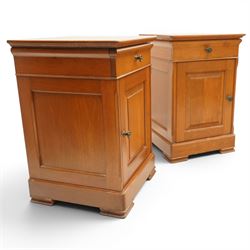 St Michael - pair of cherrywood bedside tables, single drawer above a fielded panel door, brass pulls, raised on a plinth base