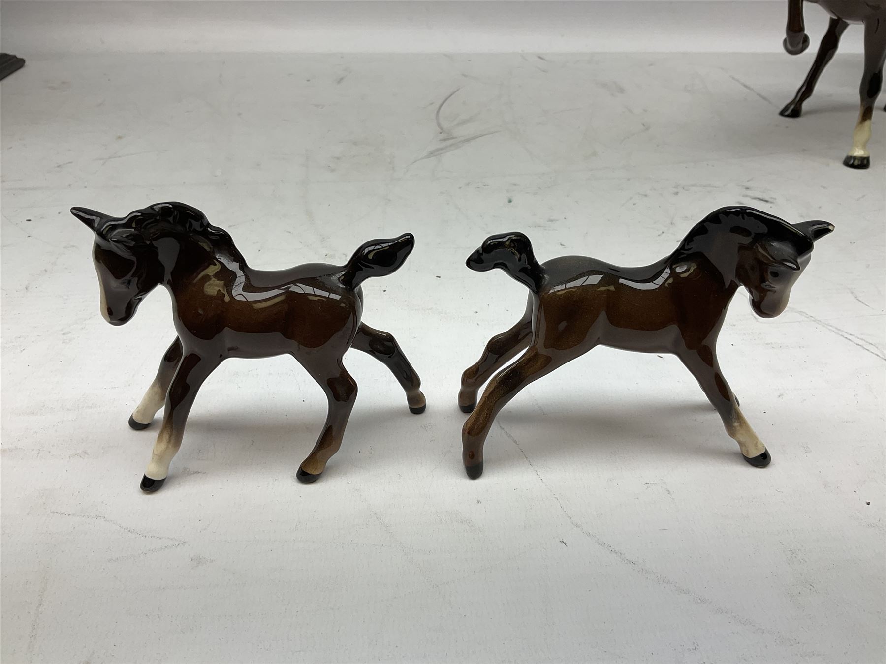 Six Beswick figures of bay horses, including large hunter no.1734, Shire horse no.818, horse with tucked head no.1549, etc (6)