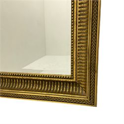 Heavy rectangular gilt framed wall mirror, bevelled glass