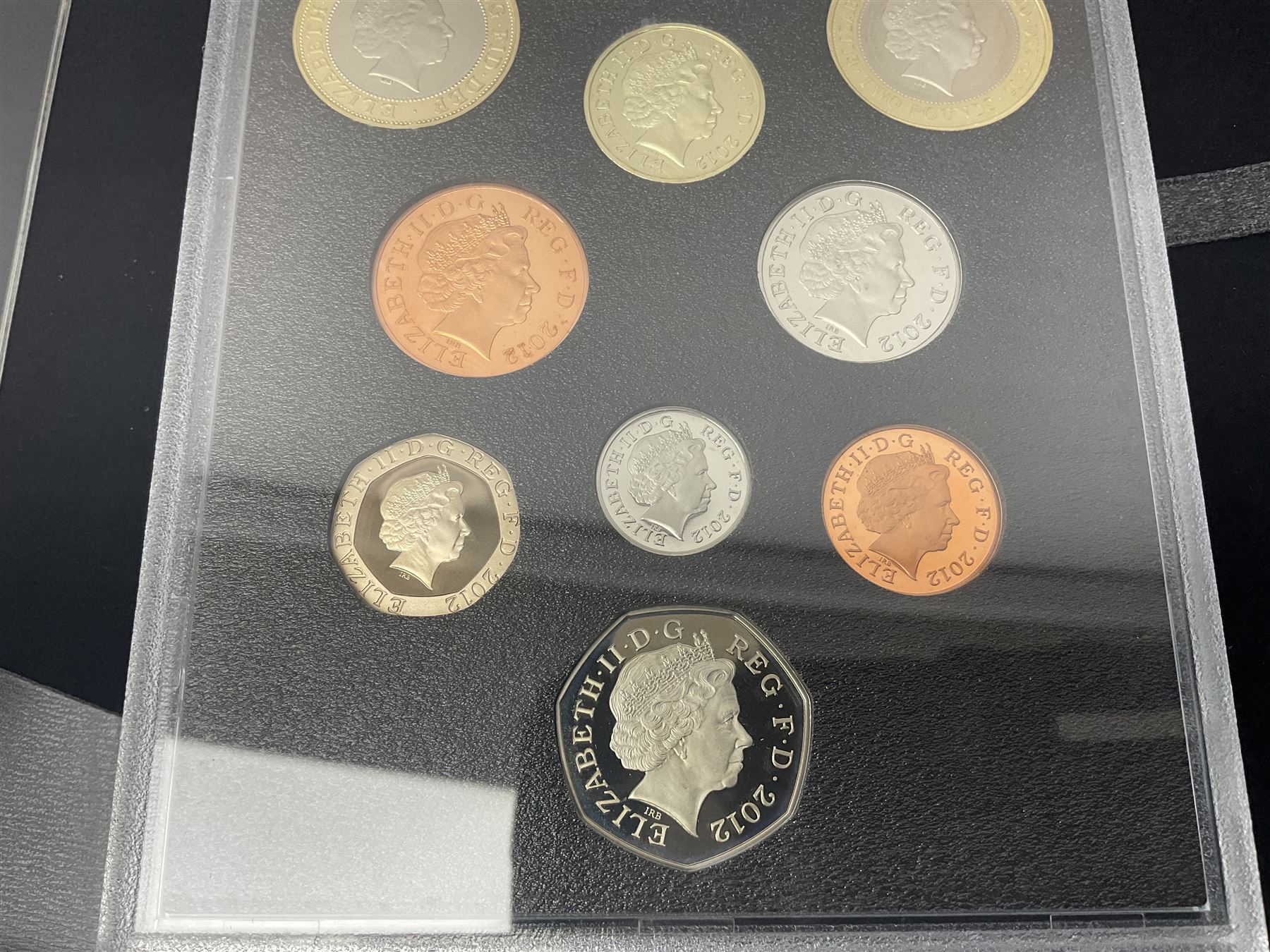 Mostly commemorative coinage, including various Queen Elizabeth II United Kingdom brilliant uncirculated fifty pence, two pound and five pound coins in card folders, The Royal Mint United Kingdom 2012 proof coin set, Alderney 2021 'Royal National Lifeboat Institution' five pound coin cover in Harrington and Byrne folder etc