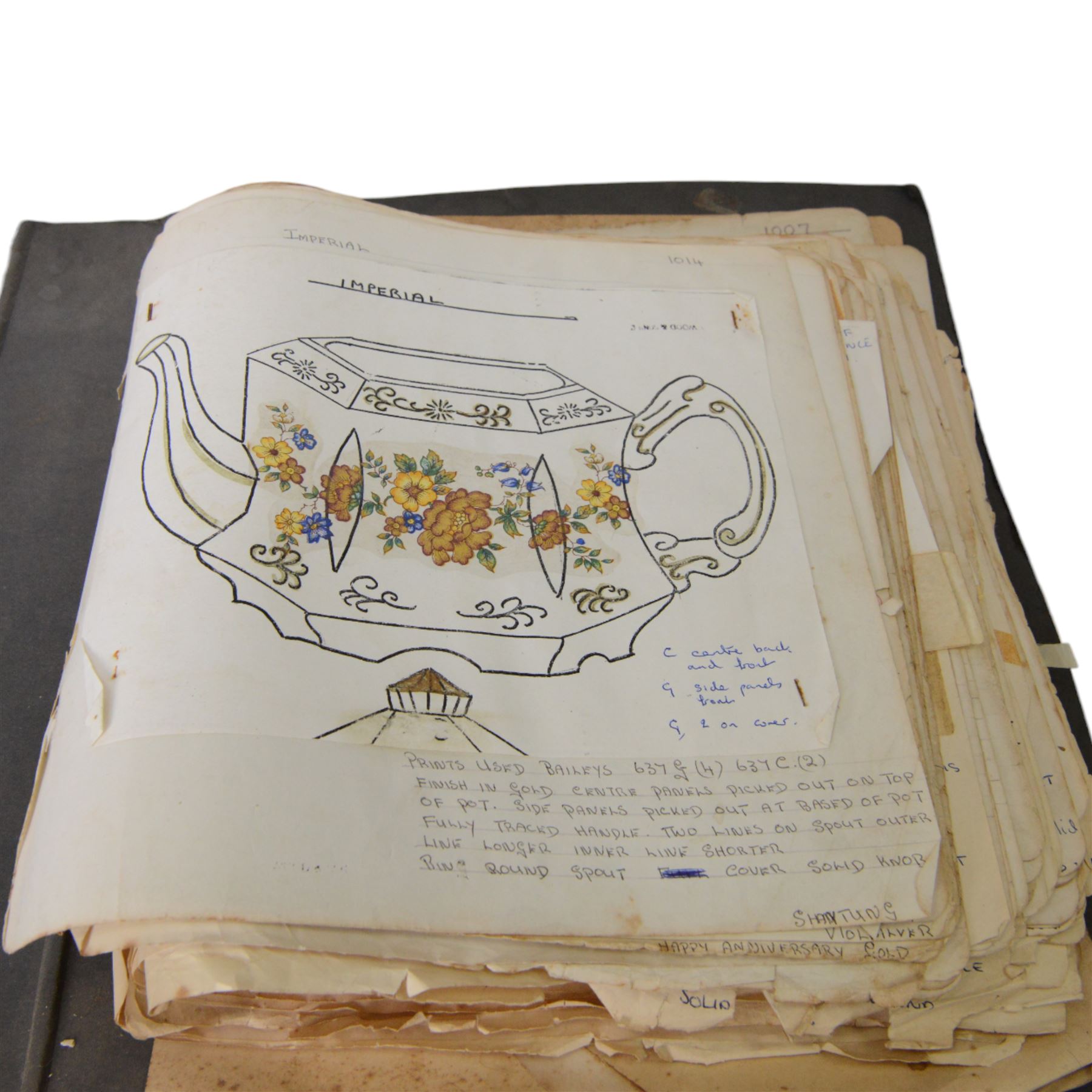 Wood & Sons Ltd Burslem pattern book, late 20th century, designs in colour and black and white, all mounted onto square leaves, leaves annotated with decorating notes, some cancellations noted boldly over the design, collected as one in a ring binder, factory labels to upper-cover, folio 44.5 x 36cm