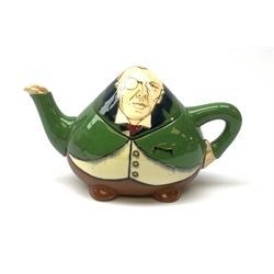 A Foley Intarsio teapot modelled as Joseph Chamberlain, designed by Frederick Rhead, with printed marks beneath, no 63131, H11cm. 
