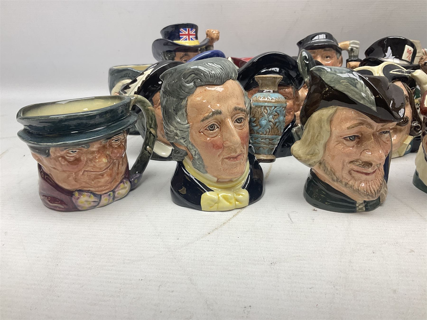 Large collection of Royal Doulton miniature character jugs, to include The Postman D6801, The London 'Bobby' D6762, Old Salt, D6554, Sir Henry Doulton D6703 etc  