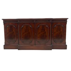 Wade Georgian style mahogany break front sideboard, fitted with four drawers and four cupboards