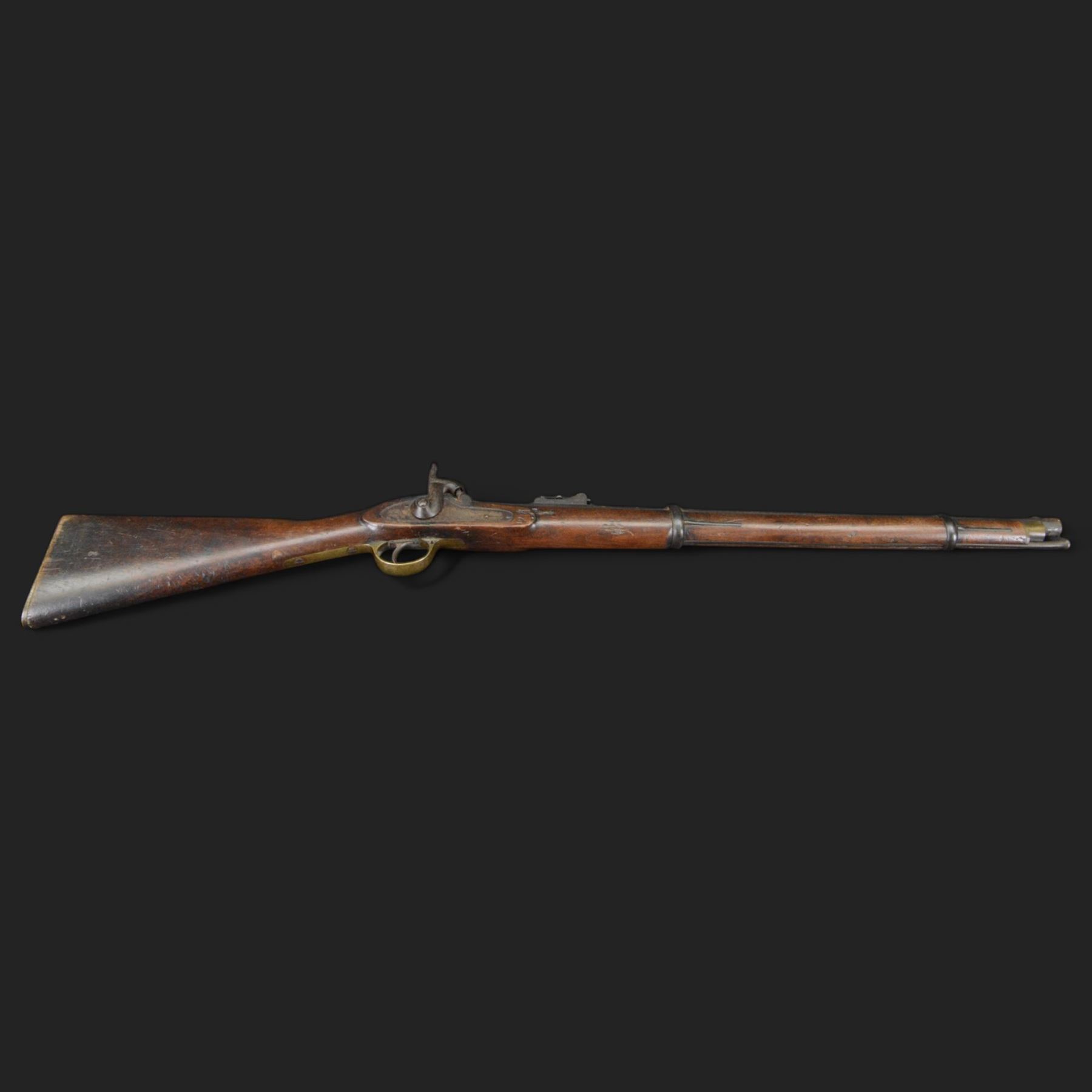 Two-Band short service musket, the L66cm barrel with sold out of service marks and indistinct marks, with ram rod beneath, the lock marked with crowned and Windsor 1855, overall L108cm
Sold as an exempt item under Section 58 (2) of the 1968 Firearms Act, to be held as a curiosity or ornament