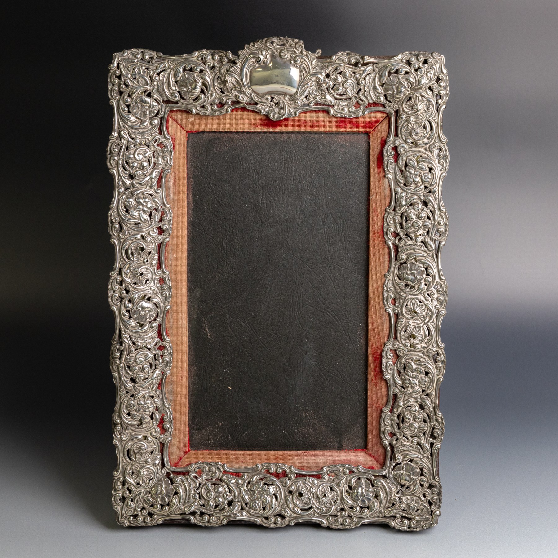 Edwardian silver mounted photograph frame, of rectangular form embossed with scrolling floral and foliate decoration, with easel support verso, hallmarked Henry Matthews, Chester 1905, H37cm