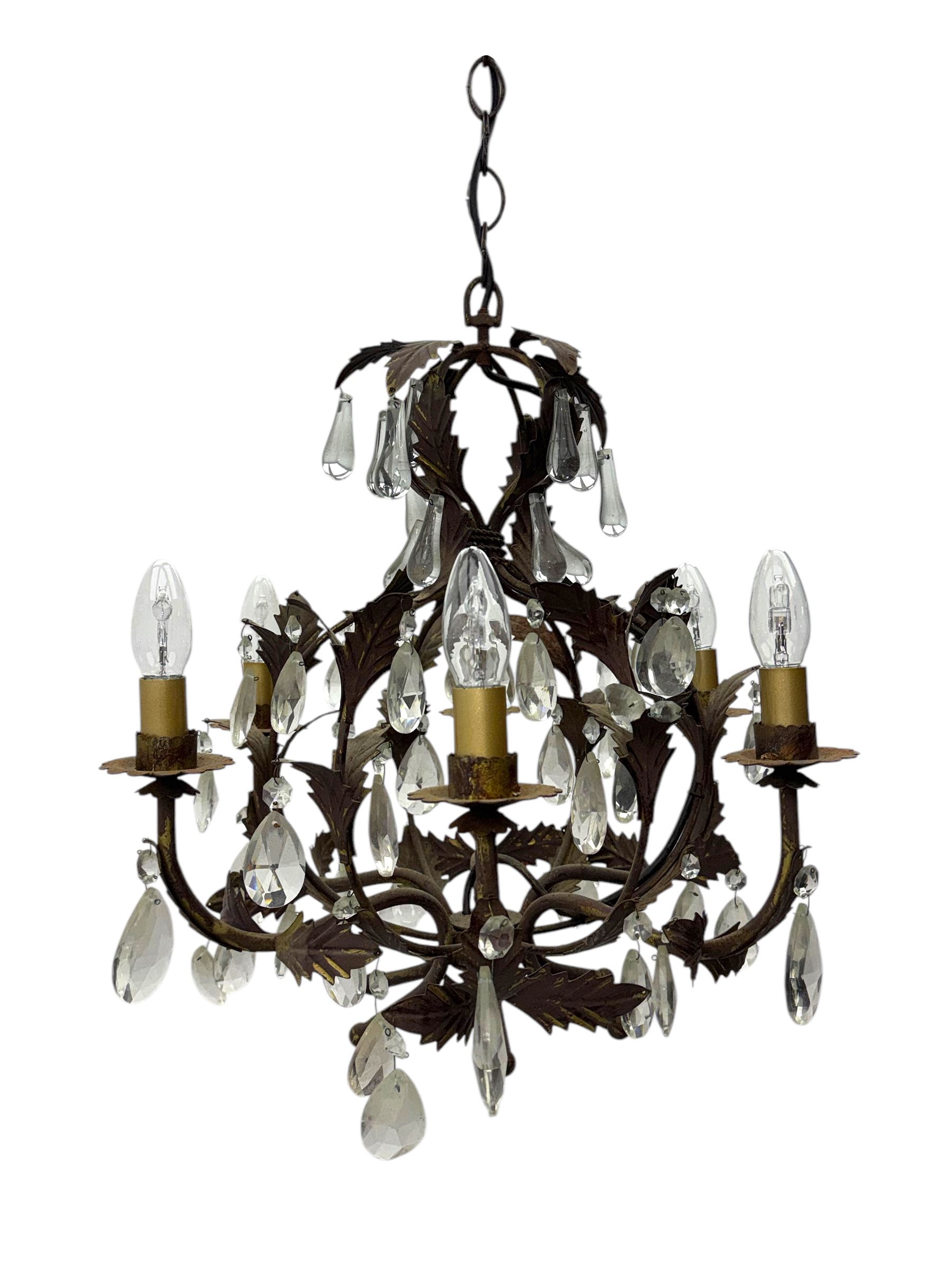 20th century distressed gilt tole chandelier, with six curved leaf clasped scrolling arms and frame, hung with lustre drops, approximately H50cm