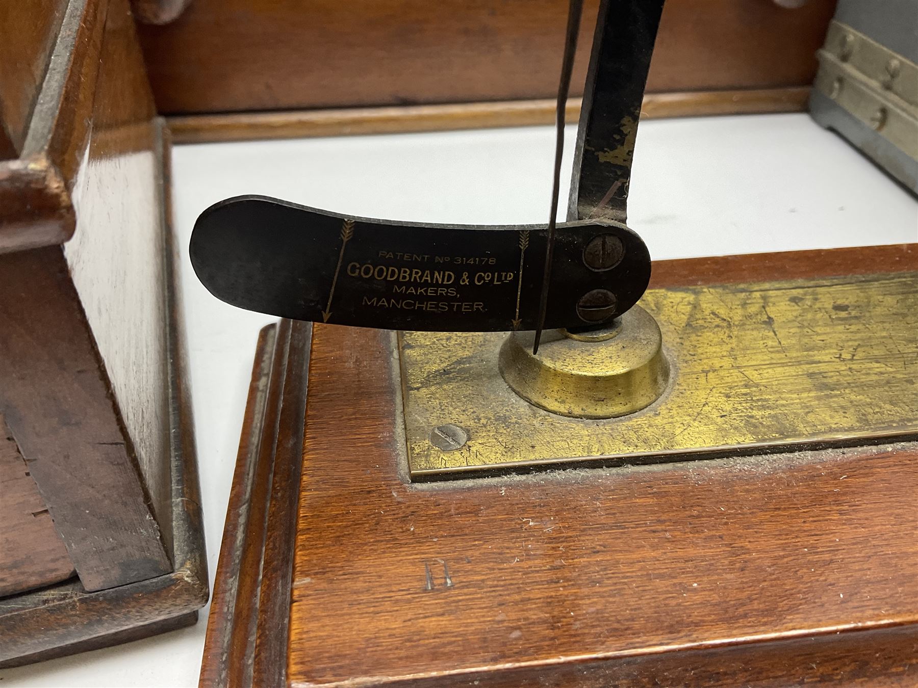 Collection of textile equipment, comprising, Goodbrand & Co. mahogany and brass yarn tester, Negretti & Zambra barograph and two sets of precision scales