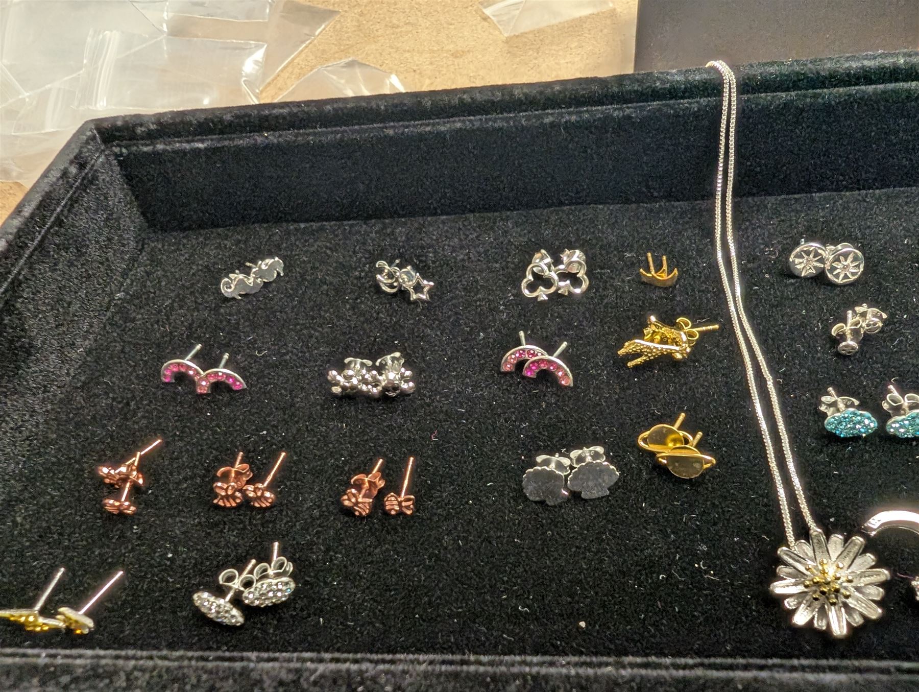 Group of silver earrings, including rainbows, clouds, skulls, crosses, etc, stamped 925