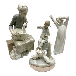 Lladro figures, Girl with Doll, no 1083, together with two Nao figures, and another similar